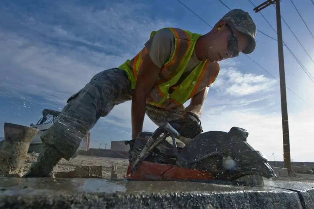construction worker using a generator